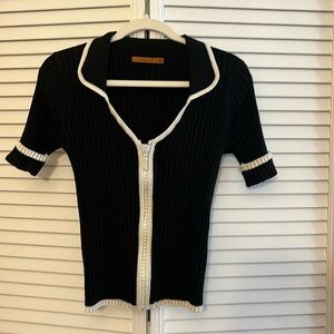 Belldini. . Black w/white trim Zippered front , collared sweater size M